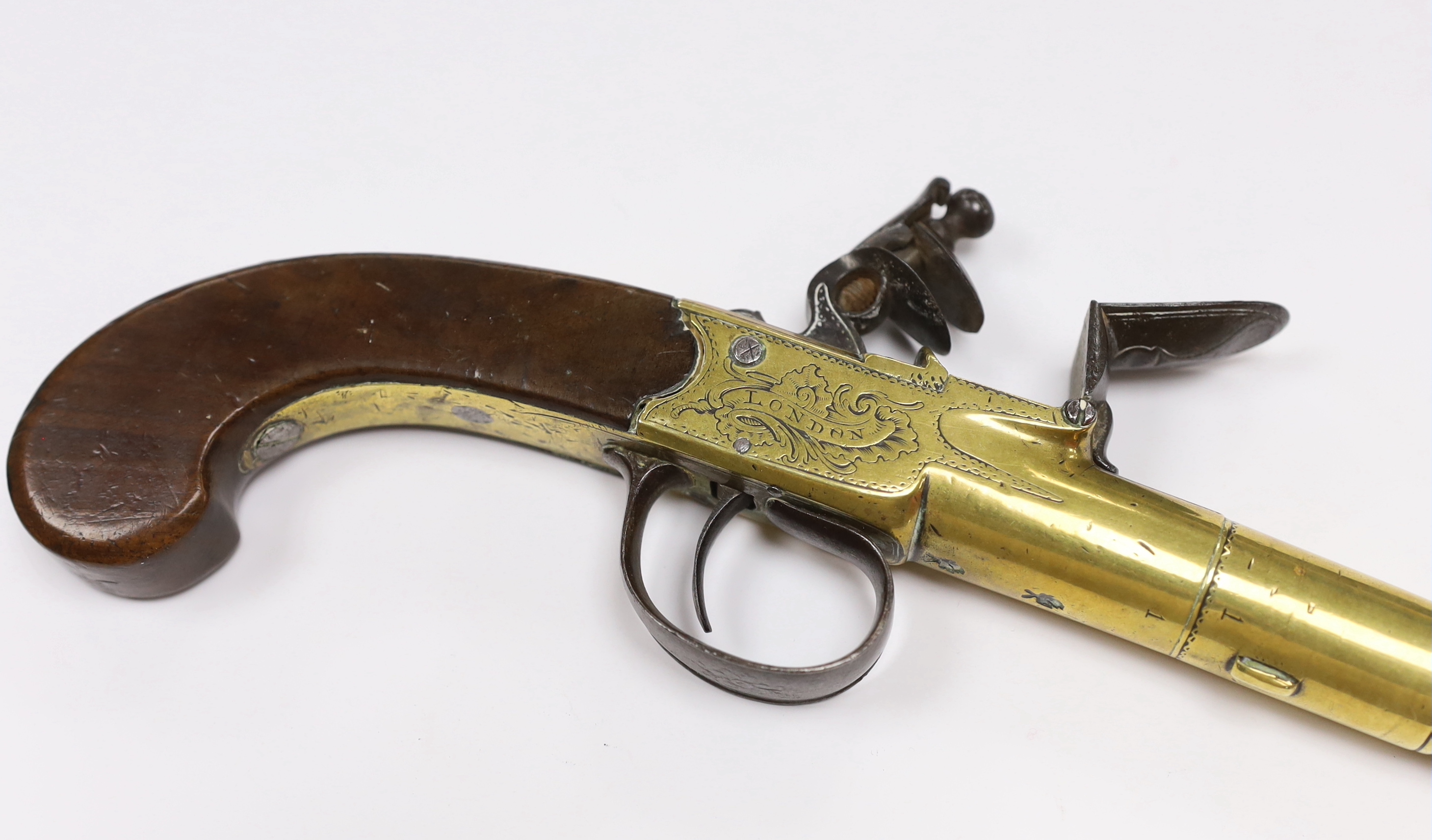 A Queen Anne style, brass cannon barrel boxlock flintlock holster pistol by Hadley of London, with turn-off barrel, private tower proofs, frame signed by the maker, walnut slab grip with unusual silver scion in the form